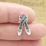 Elegance in Miniature: The Timeless Appeal of the Antique Silver Pewter Ballet Shoes Charm