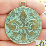 Hammered Fleur De Lis Pendants Wholesale in Gold Pewter with Patina